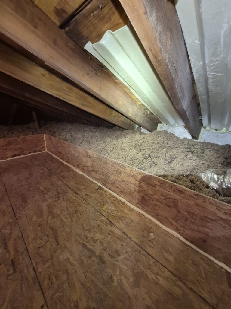 attic cellulose insulation at platform edge