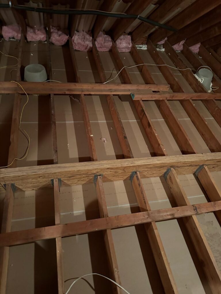 attic floor joists and sealed penetrations