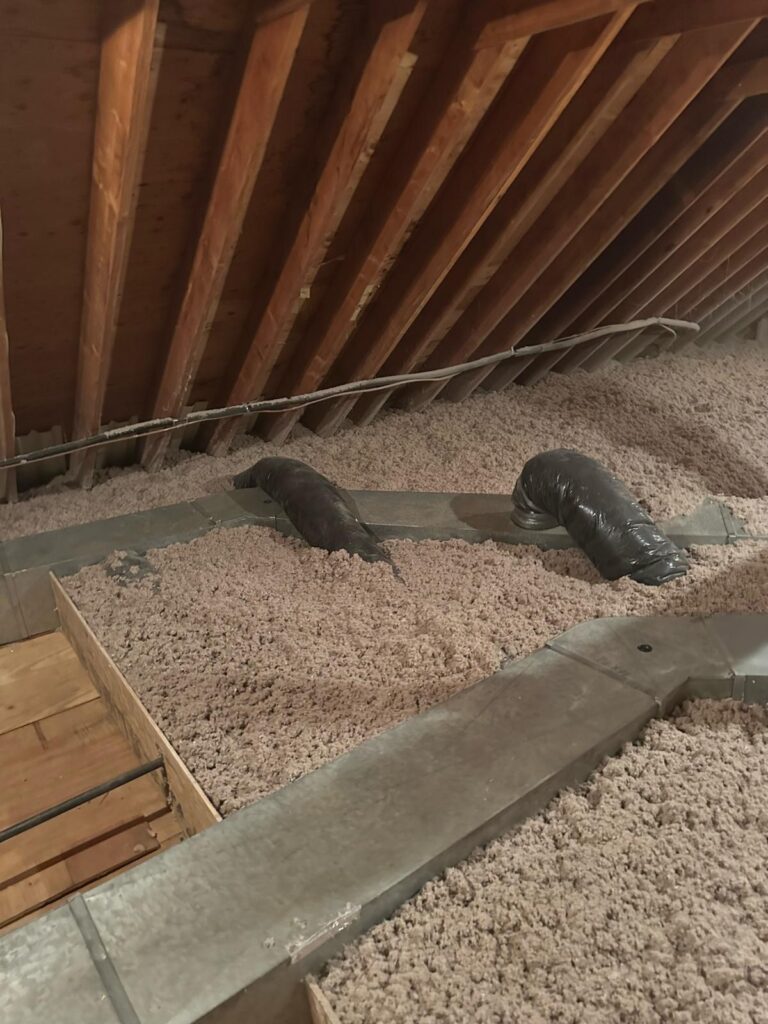 attic insulation surrounding duct branches