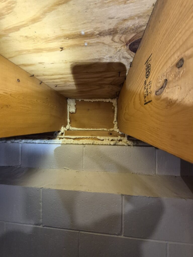 basement rim joist area with spray foam