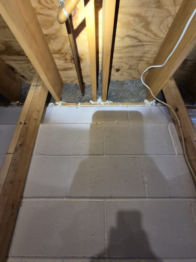 basement top of wall foam sealing