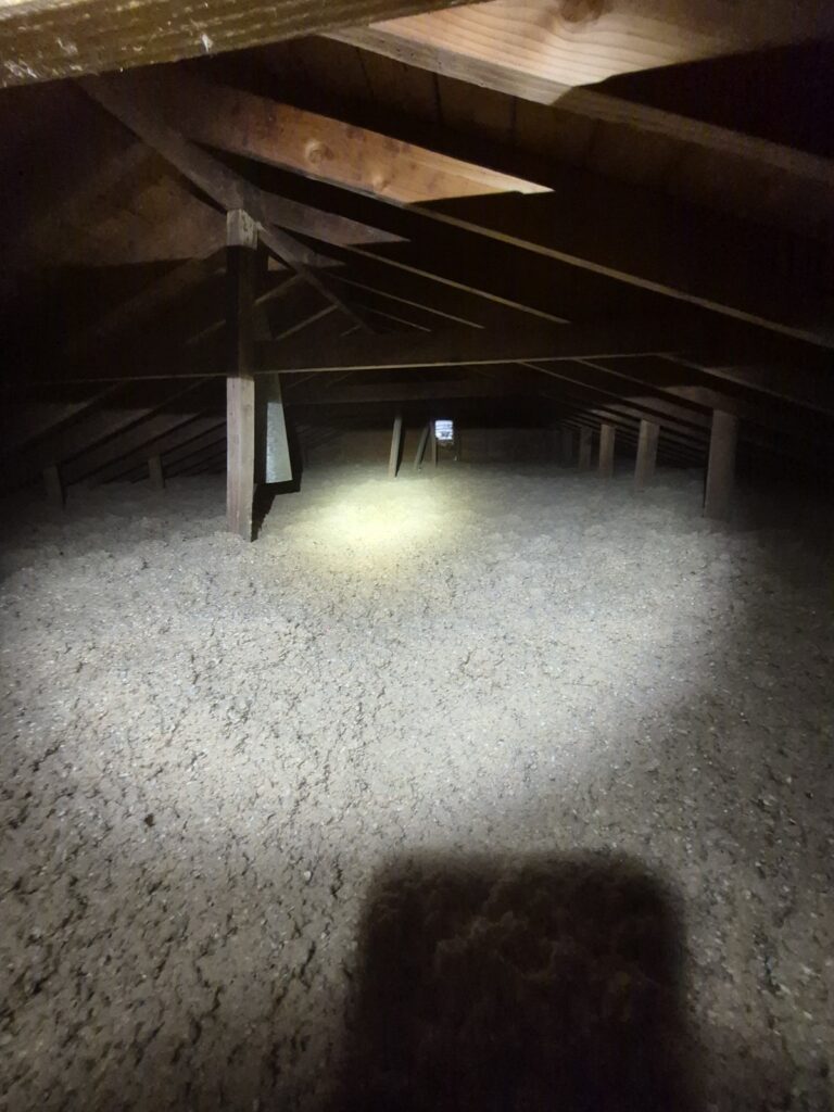 blown in cellulose across low attic