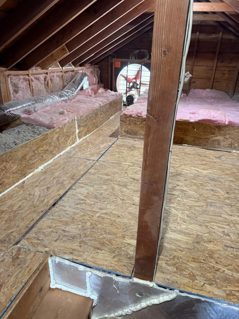 cellulose insulation along attic storage area