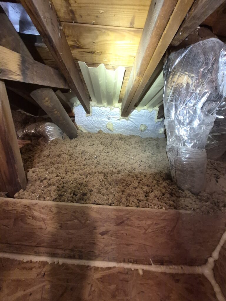 cellulose insulation in narrow attic bay