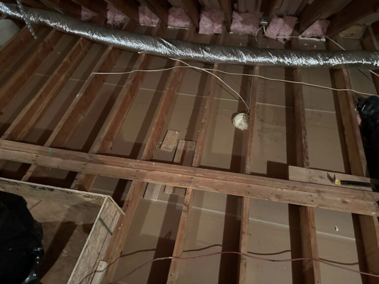 exposed attic floor before insulation