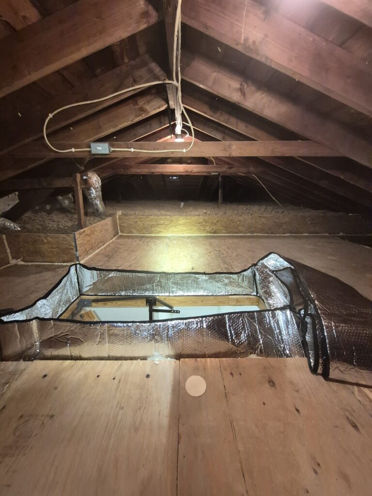 foil lined attic hatch and plywood deck