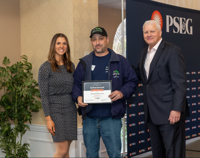 Liad Messinger and the Home Insulation Experts team receiving a PSE&G energy-efficiency award