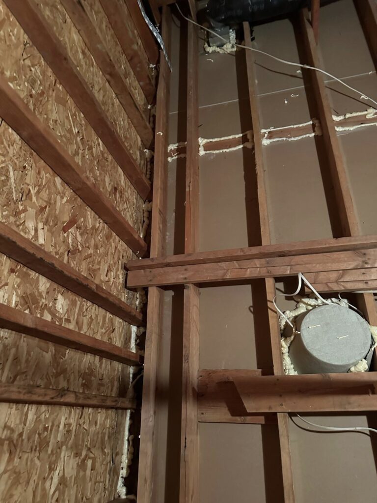 sealed attic penetration beside roof framing