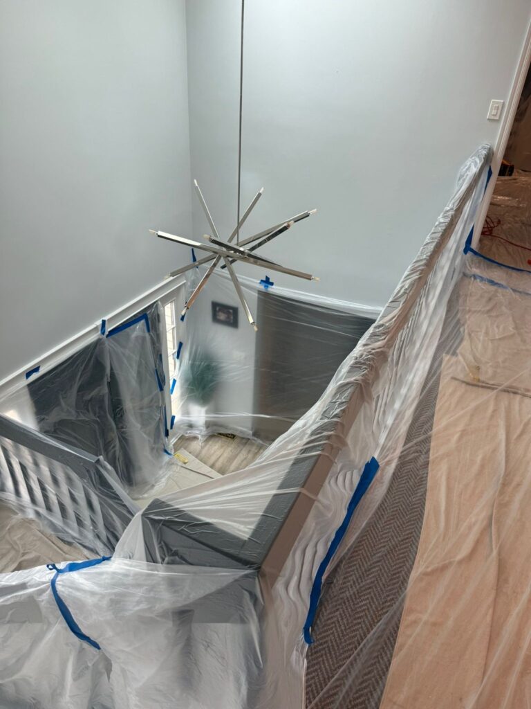stairwell railing protected for overhead work